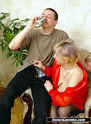 Mother in black stockings does blowjob for her young beer-drinking son